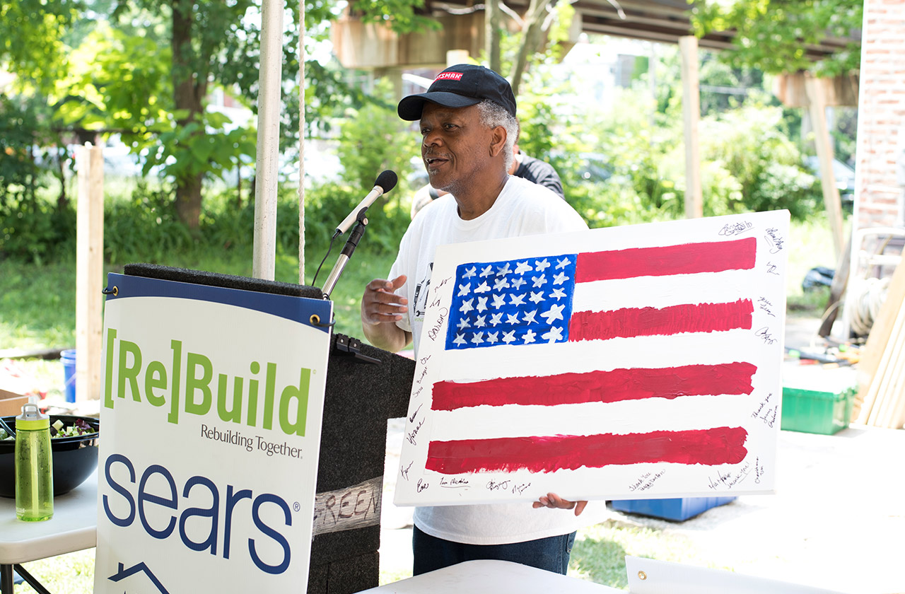 Veteran speaking to volunteers at Heroes at Home event in Chicago.